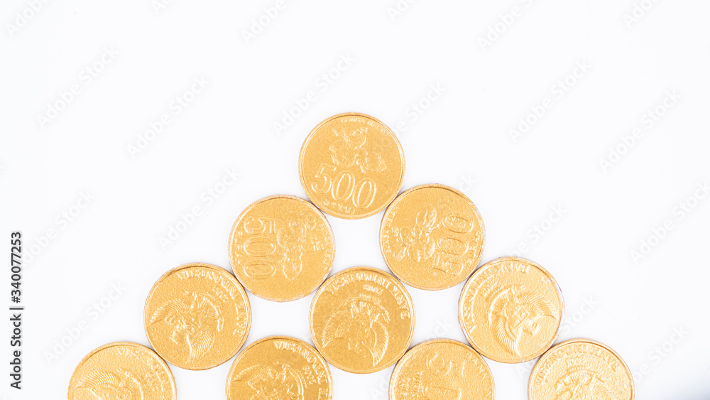 Flat lay of golden coins on white background Flat lay of golden coins on white background