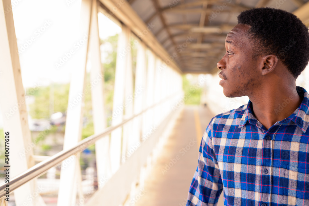 © Ranta Images - Young handsome African man exploring the city © Ranta Images - Young handsome African man exploring the city