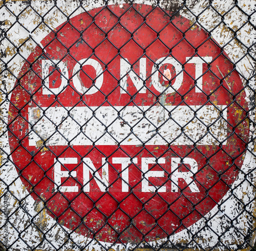 Do Not Enter Sign Behind Chainlink Fence