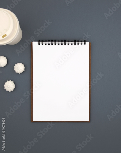 White notepad sheet on gray background. View from above
