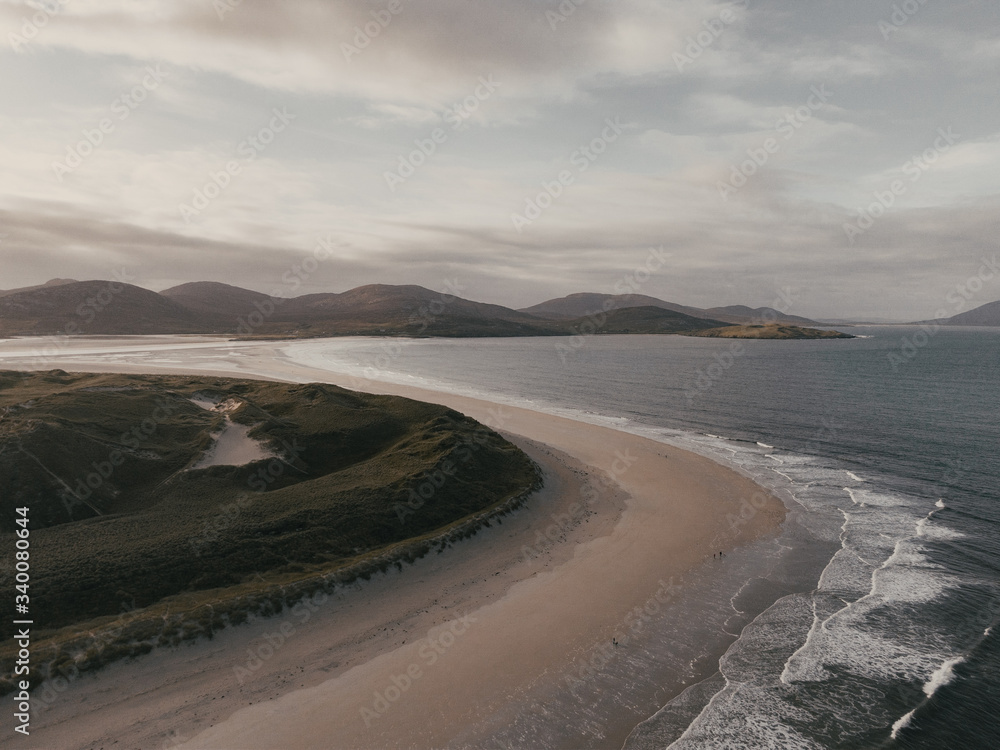 Aerial drone photo of Traigh Rosamol point at Luskentyre beach on the western coast of the Isle of Harris in Scotland. Lovely sunny day. Aerial drone photo of Traigh Rosamol point at Luskentyre beach on the western coast of the Isle of Harris in Scotland. Lovely sunny day.