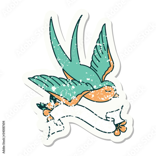 grunge sticker with banner of a swallow