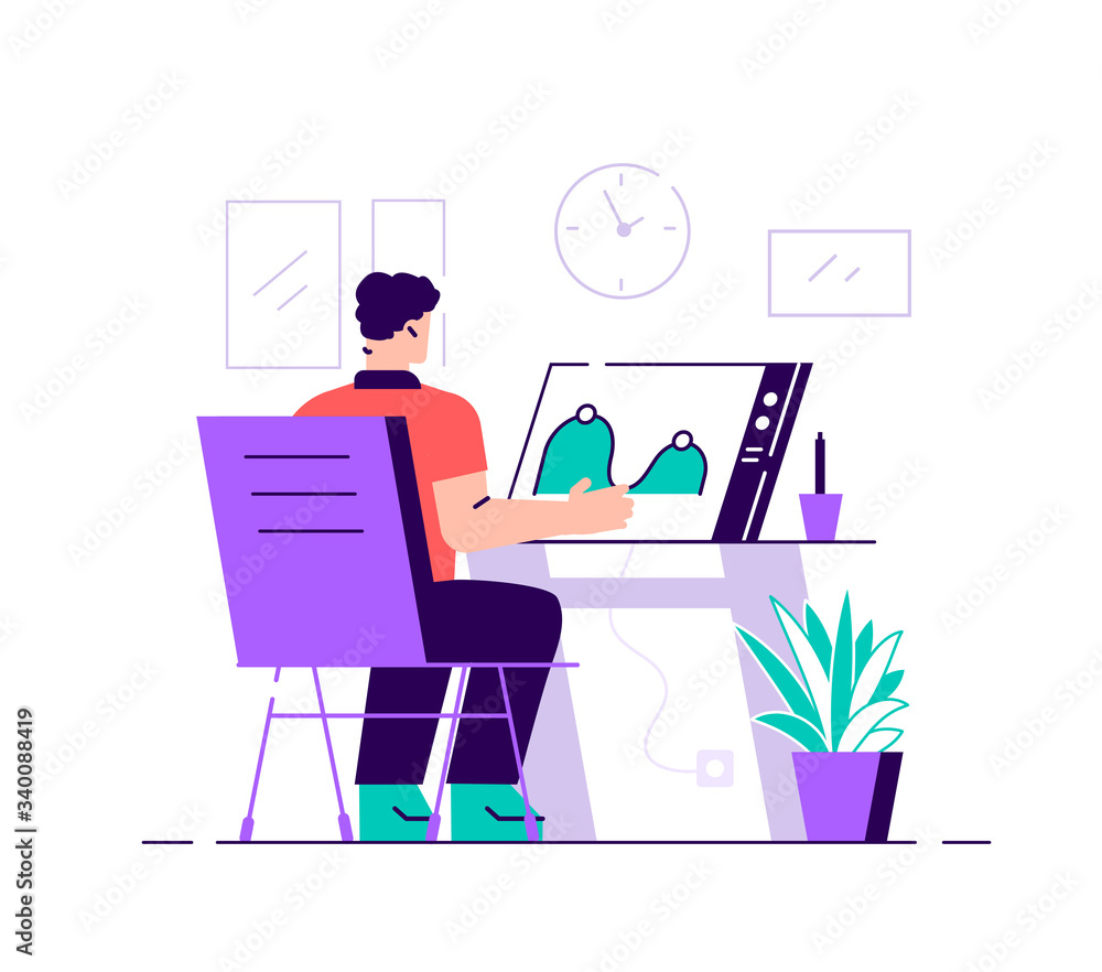 Funny young man sitting at desk and drawing Funny young man sitting at desk and drawing