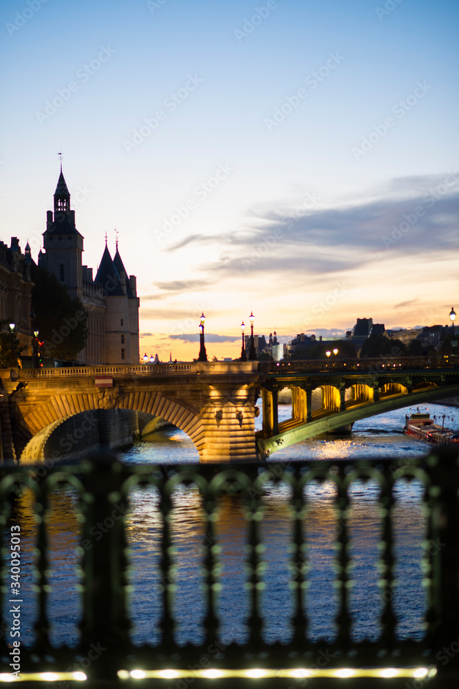Paris at night with amazing sky and bridge river and castle
