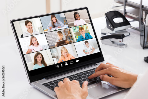 Businesswoman Filling Survey On Laptop