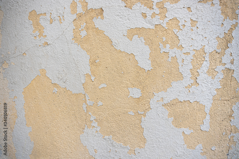 old wall background with peeling paint from 