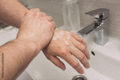 Washing hands rubbing with soap man for corona virus prevention, hygiene to stop spreading coronavirus.sanitiser, covid 19