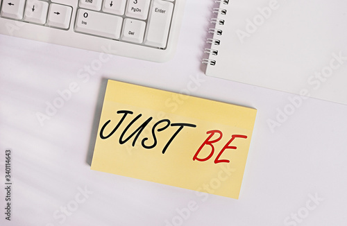 Text sign showing Just Be. Business photo showcasing to do the things you believe in and want to be accepted for Empty note paper on the white background by the pc keyboard with copy space photo