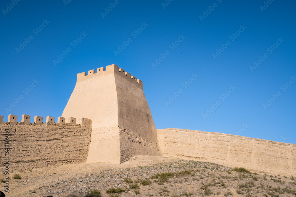The majestic Jiayuguan City watchtower in Gansu Province, China. Chinese characters on black plaque: Jiayuguan.The majestic Jiayuguan Great Wall Corner Tower in Gansu , China.The turret of the wall