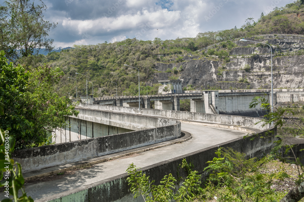 dramatic image of Presa Jiguey Dam highn in the caribbean mountains of the dominican republic.