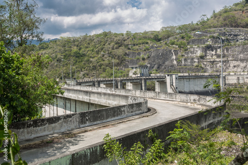 dramatic image of Presa Jiguey Dam highn in the caribbean mountains of the dominican republic. photo
