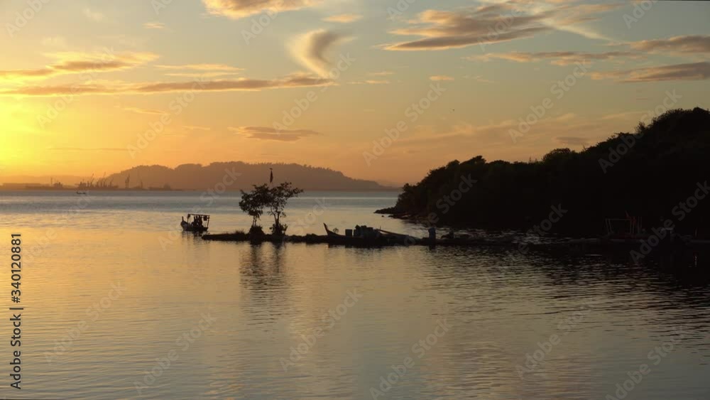 Silhouette fishing boat departure go to sea in sunrise morning. Silhouette fishing boat departure go to sea in sunrise morning.