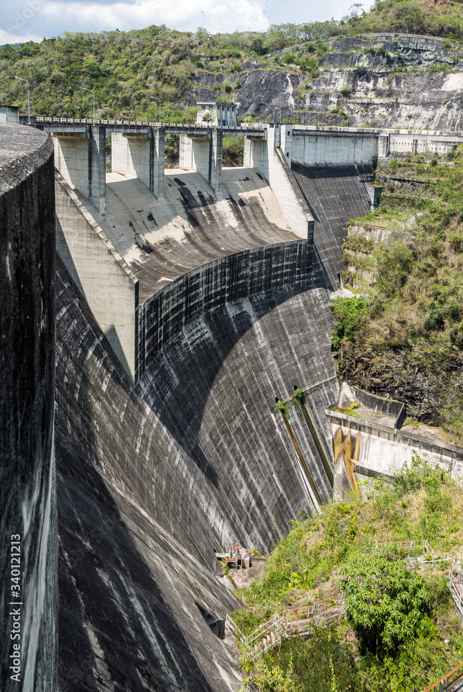 dramatic image of Presa Jiguey Dam highn in the caribbean mountains of the dominican republic.