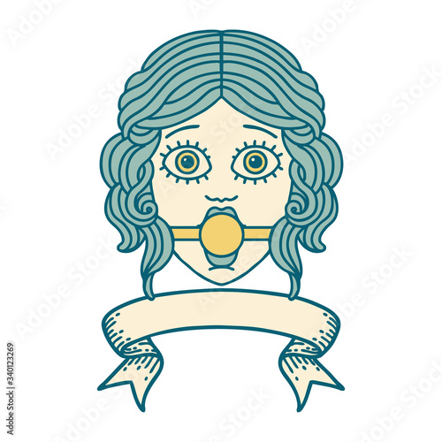 tattoo with banner of female face with ball gag