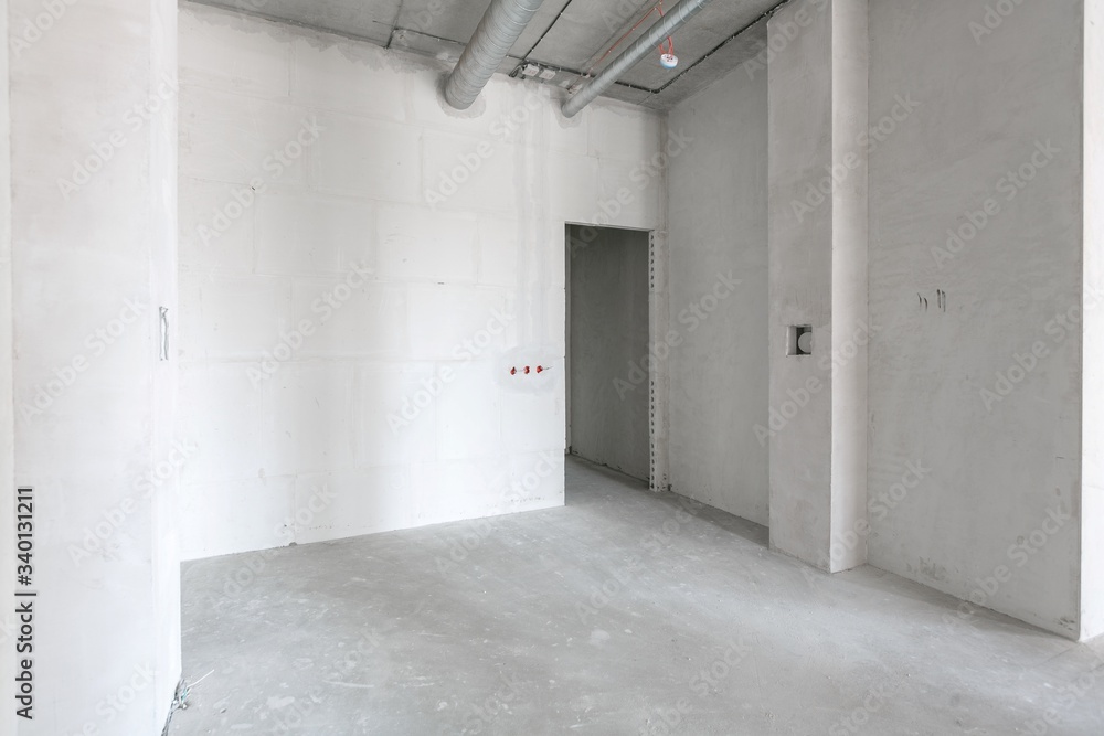 empty pure commercial office building undecorated in gray colors.open space office empty pure commercial office building undecorated in gray colors.open space office