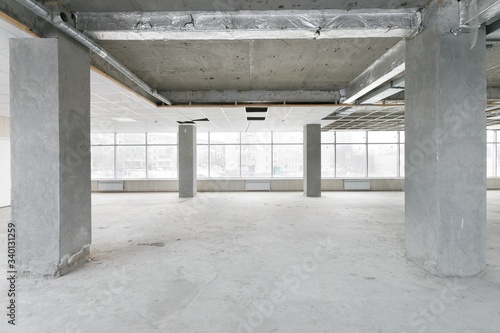 empty pure commercial office building undecorated in gray colors.open space office