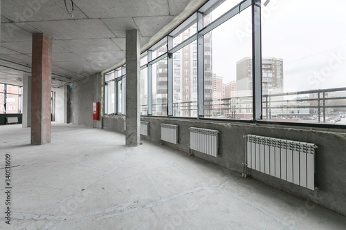 empty pure commercial office building undecorated in gray colors.open space office