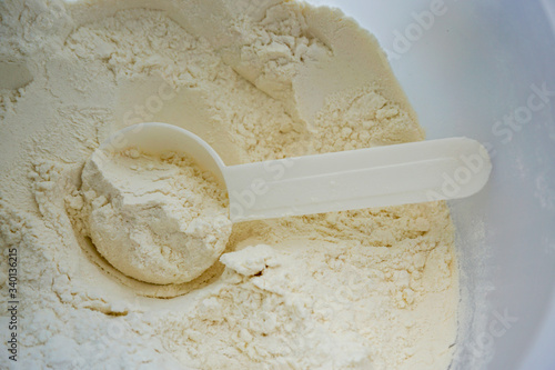 Принти на полотні measuring spoon for protein, flour, white yellowish friable material ingredient