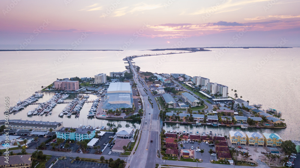 Fototapeta premium Honeymoon Island and Dunedin Causeway Florida. Gulf of Mexico. Beautiful ocean sunset. Summer or spring vacations.