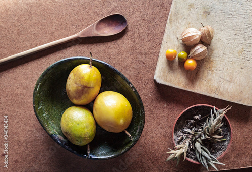 Passion fruit still life on a wooden background. Healthy, organic food concept