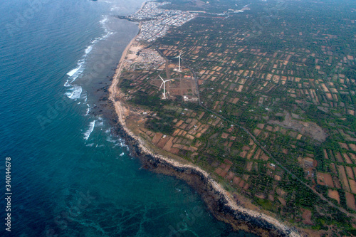 Aerial view of landscape with Turbine Green Energy Electricity, Windmill for electric power production, Wind turbines generating electricity on Phu Qui island, Binh Thuan, Vietnam. 
