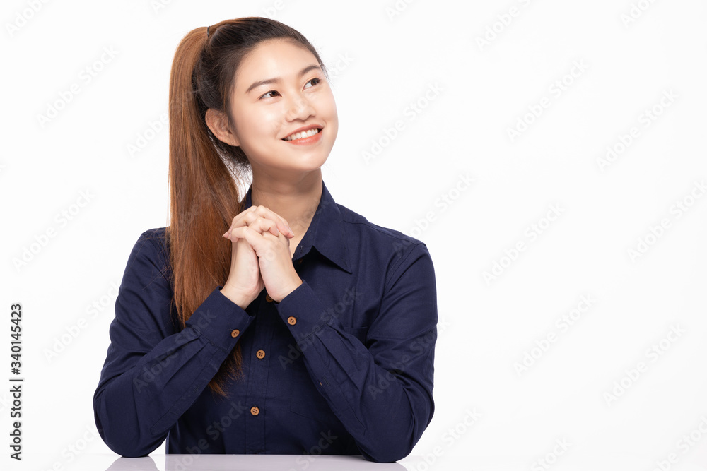 beautiful business Asian woman wearing blue shirt smile holding hands and looking away to copy space with happiness and confident feeling,Isolated on white,Positive emotional beautiful business Asian woman wearing blue shirt smile holding hands and looking away to copy space with happiness and confident feeling,Isolated on white,Positive emotional