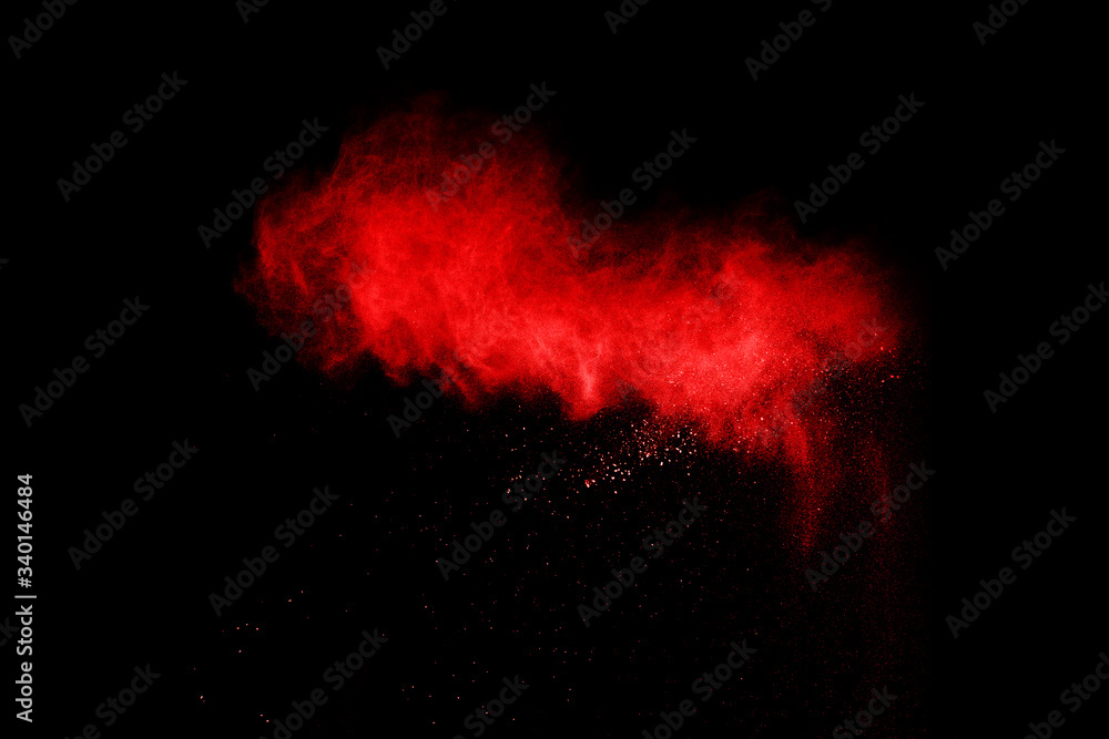abstract red powder explosion on black background.abstract red powder splatted on black background. Freeze motion of red powder exploding. abstract red powder explosion on black background.abstract red powder splatted on black background. Freeze motion of red powder exploding.