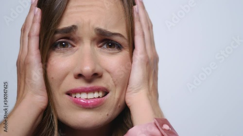 Wallpaper Mural Businesswoman holding hands on head in studio. Lady having stress after work Torontodigital.ca