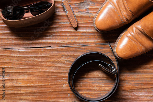Men accesories flat lay on a rustic table