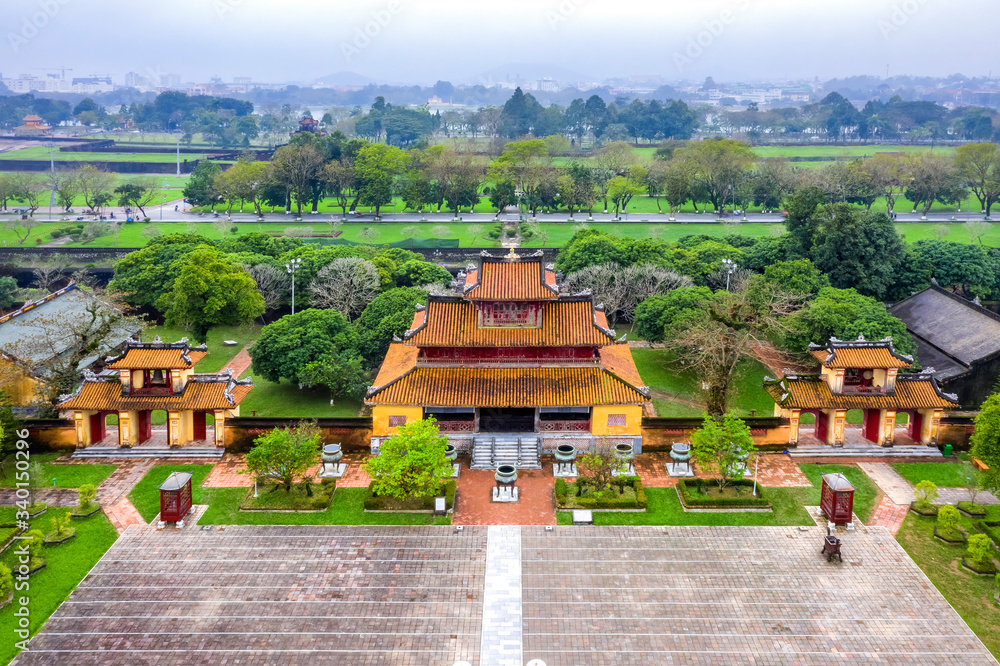 Wonderful view of the “ Meridian Gate Hue “ to the Imperial City with the Purple Forbidden City within the Citadel in Hue, Vietnam. Imperial Royal Palace of Nguyen dynasty in Hue. The To Mieu house