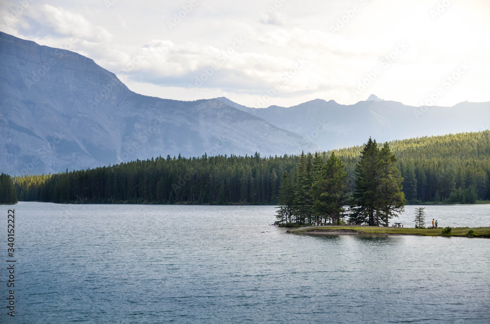 Two jack lake landscape view in Banff canada in summer daytime. Lake at Natural national park in north america-canada with sunshine ray