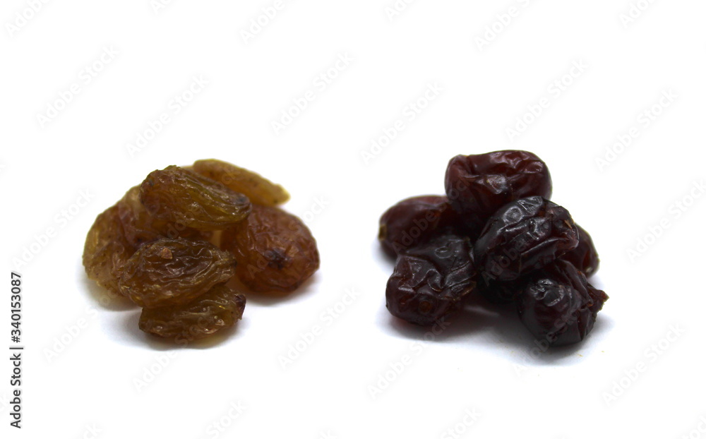 Raisins and dried cranberries isolated on white background Raisins and dried cranberries isolated on white background