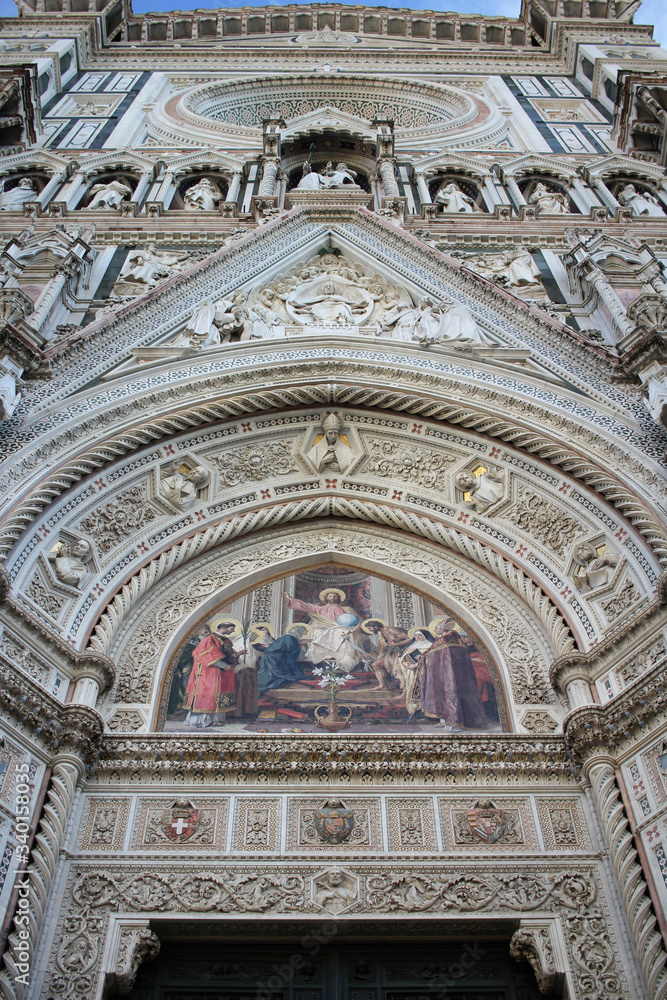 The marvellous art statue and painting decorated surrounding on Florance duomo, The mistery sculpture on Famous white Architectural cathedral church under blue sky at Florance, The largest church in I