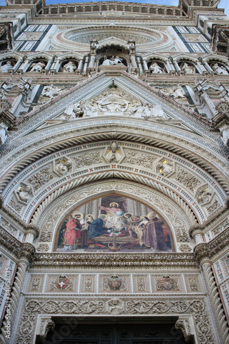 The marvellous art statue and painting decorated surrounding on Florance duomo, The mistery sculpture on Famous white Architectural cathedral church under blue sky at Florance, The largest church in I