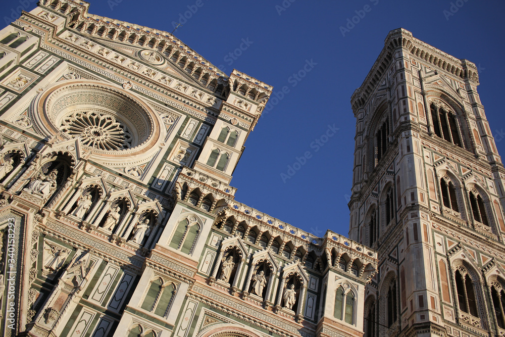 The marvellous art statue and painting decorated surrounding on Florance duomo, The mistery sculpture on Famous white Architectural cathedral church under blue sky at Florance, The largest church in I