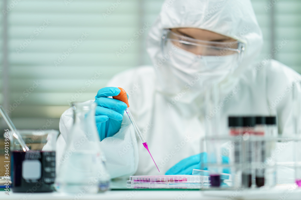Scientist in laboratory with biological tube for analysis and sampling of Covid-19. Scientist in laboratory with biological tube for analysis and sampling of Covid-19.