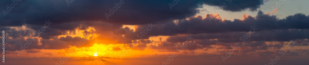 Dramatic Panoramic View of a cloudscape during a cloudy and colorful sunset. Taken over Havana, Cuba.