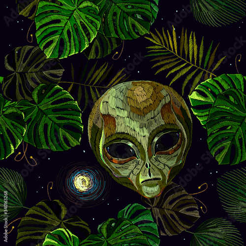 Embroidery. Alien head, moon and palm leaves, seamless pattern. Night tropical forest. Pop culture style, science fiction art. UFO, paleocontact concept. Funny template for clothes