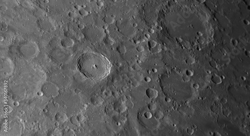 Close up to the Tycho crater on the Moon with also details into background.