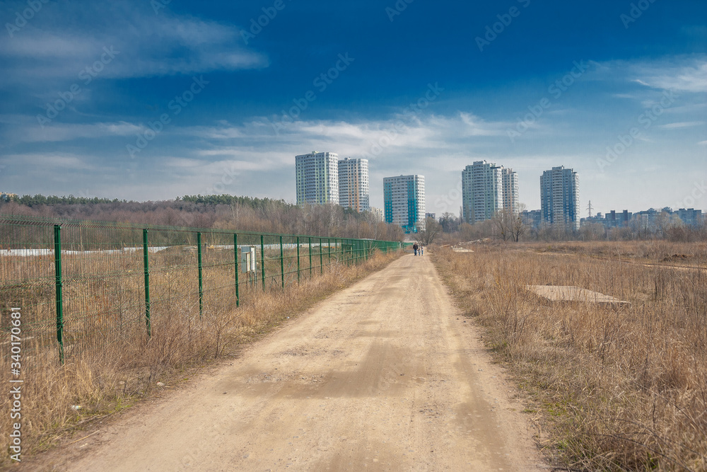 Perspective of a road with houses on the horizon Perspective of a road with houses on the horizon