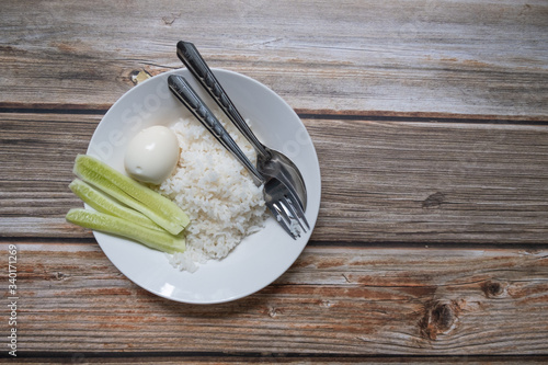 Hard-boiled eggs with hot jasmine rice. Thai food menu and healthy food. photo