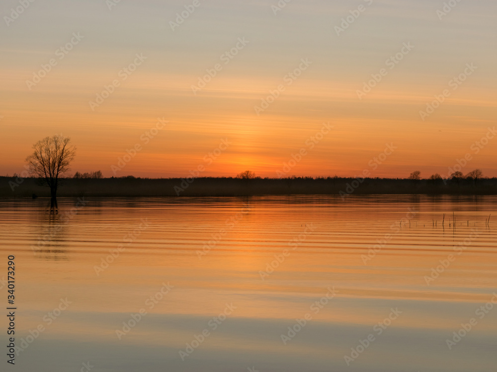beautiful sunset on the lake beach