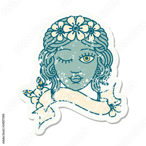 grunge sticker with banner of a maidens face winking