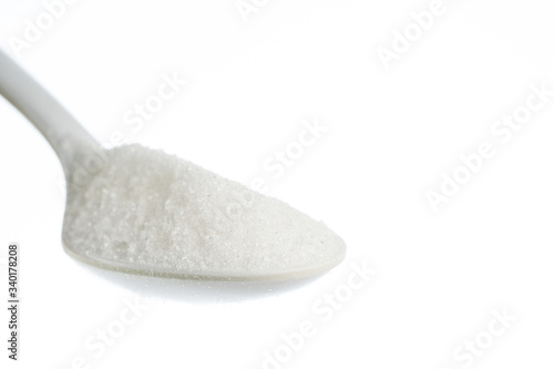 milk powder in a spoon close up shot isolate in white backgroud