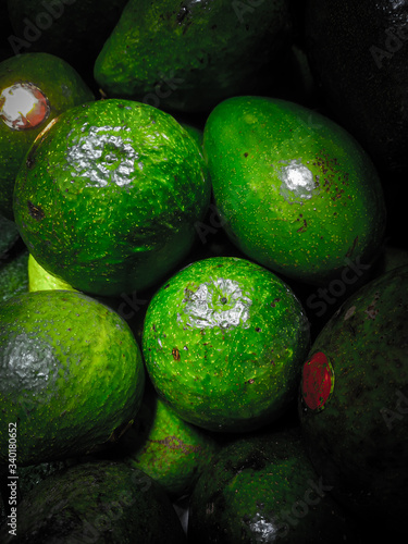 stack of tropical fruit with green skin