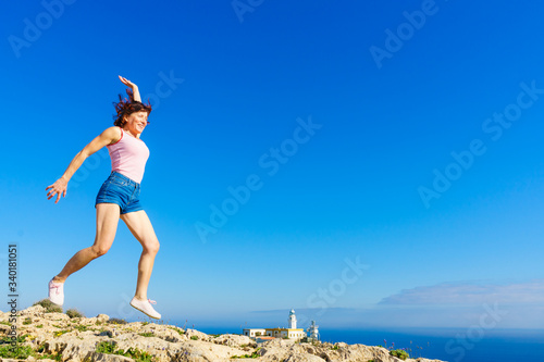 Woman enjoy trip in Spain. Mesa Roldan lighthouse location, Almeria Spain.