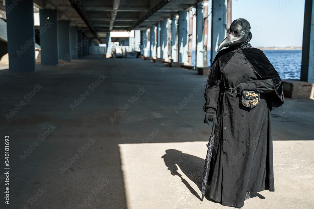 plague doctor in an empty city on an empty marina plague doctor in an empty city on an empty marina