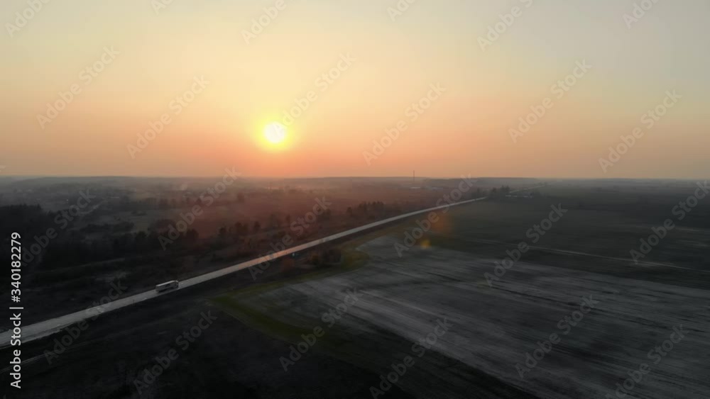 Truck rides on the road during sunset, aerial view.4k Truck rides on the road during sunset, aerial view.4k