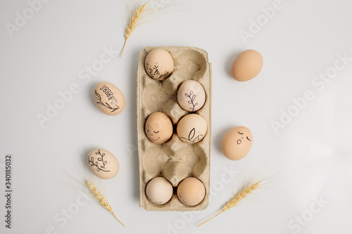 Easter eggs and easter bunny on white background with copy space. Easter background. Top view