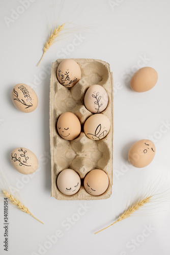 Easter eggs and easter bunny on white background with copy space. Easter background. Top view